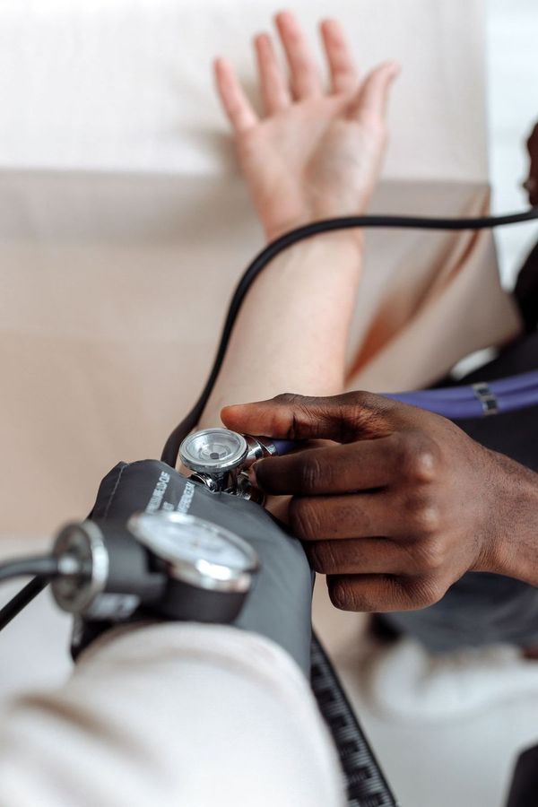 A blood-pressure cuff on a patient's arm