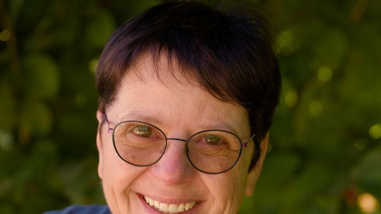 A smiling woman outdoors